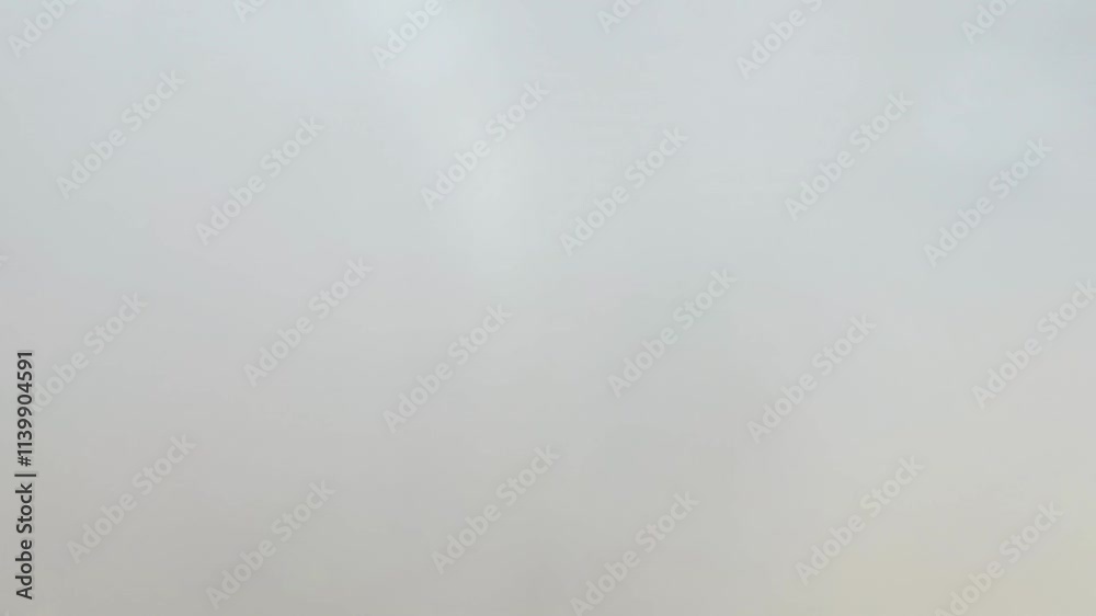 Plane descends toward clouds with ground visible far below. Ends as plane enters clouds, view turning white. Plane descends toward clouds with ground visible far below. Ends as plane enters clouds, view turning white.