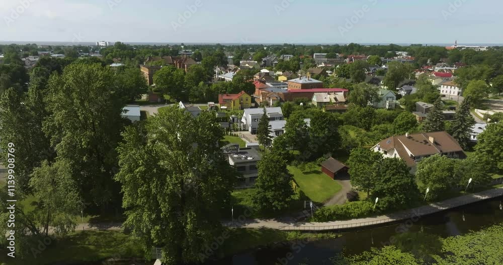 Aerial view circling modern homes in the suburbs of Parnu, Estonia, summer day Aerial view circling modern homes in the suburbs of Parnu, Estonia, summer day