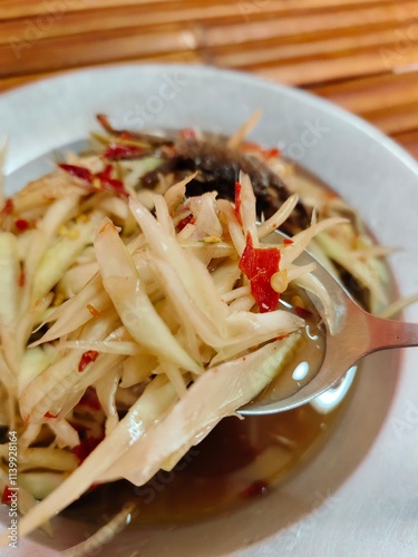 Spicy Papaya Salad with Salted Crab and Fermented fish (SOMTUM)