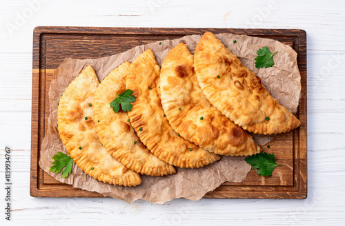 Snack chebureks. Pasties with meat photography . Top view photo