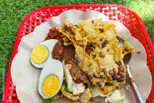 Indonesian food - gado gado on a white plate on the dining table