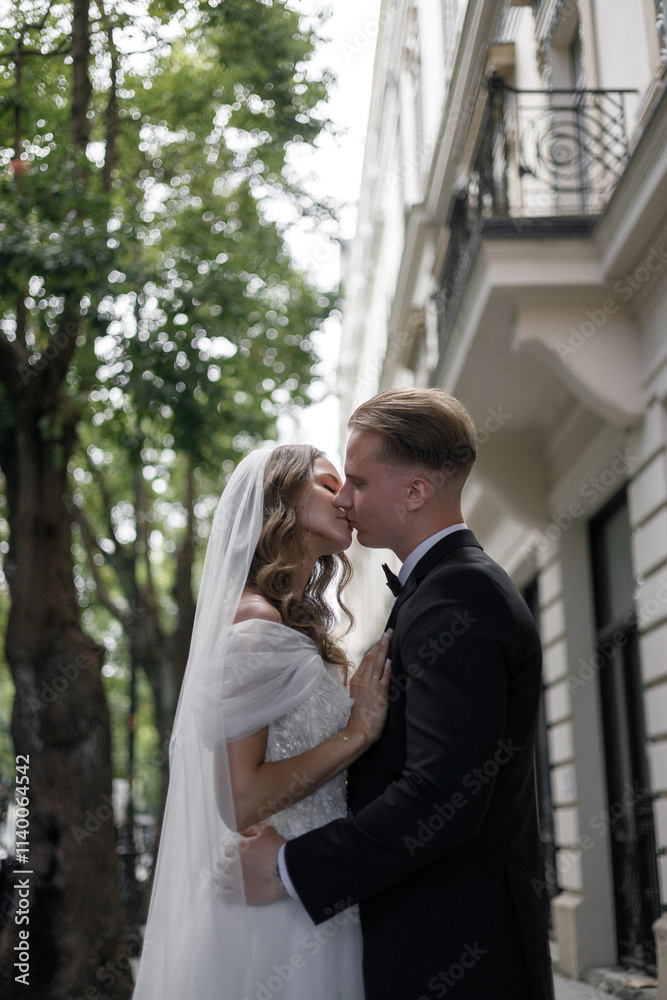 A Romantic Wedding Kiss Captured in an Elegant Setting Filled with Joy and Beauty A Romantic Wedding Kiss Captured in an Elegant Setting Filled with Joy and Beauty