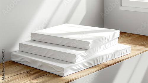 Stacked white canvases waiting for creative inspiration in a bright studio photo