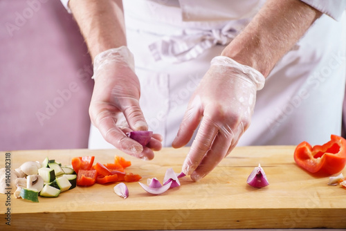 .Chef cutting fresh and delicious vegetables for cooking photo