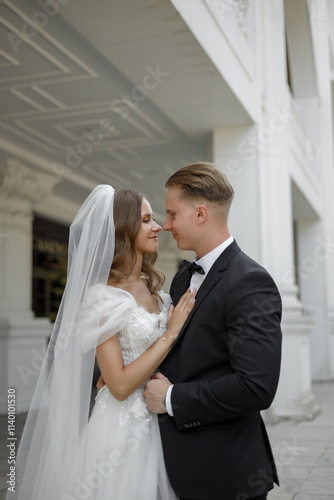 An Elegant Wedding Couple Embracing in the midst of Romantic Bliss and Affectionate Joy