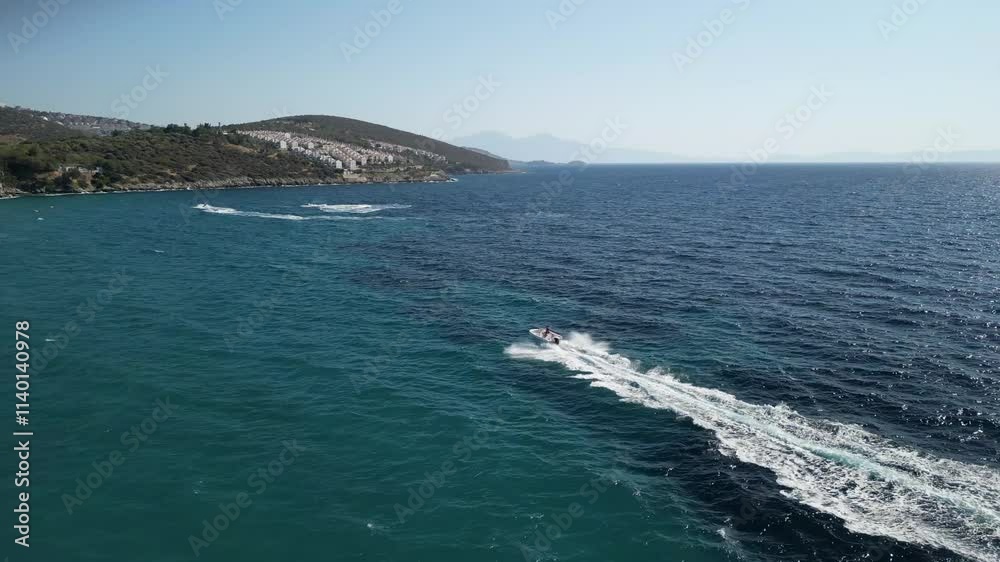 Speedboat speeds through the sea and meets jet ski in the final - water sports UHD 4K aerial Speedboat speeds through the sea and meets jet ski in the final - water sports UHD 4K aerial