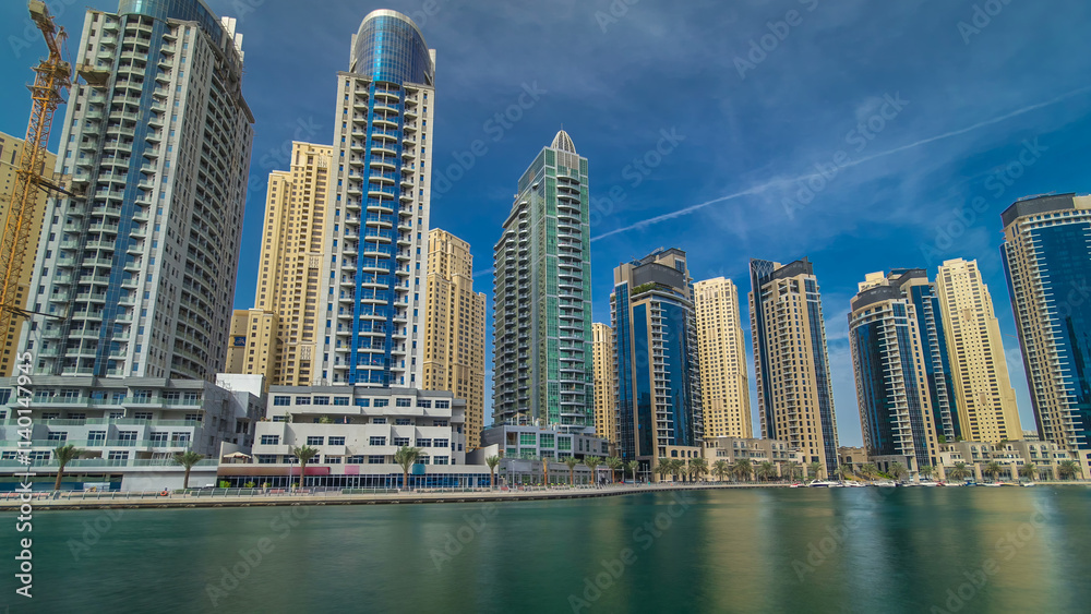 Fototapeta premium Dubai Marina towers in Dubai at day time timelapse hyperlapse