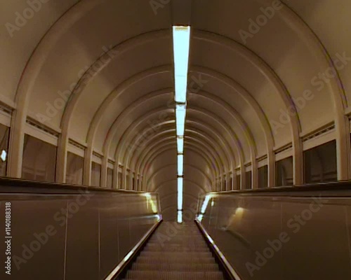Vintage camcorder shot of a subway escalator, Toulouse, France