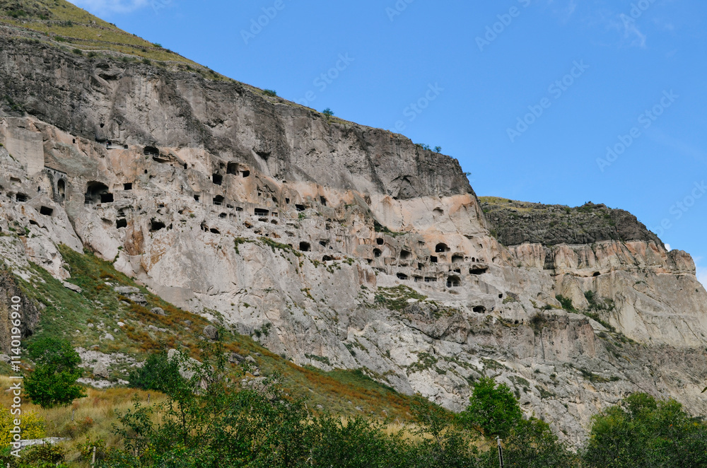 View of Vardzia caves. Vardzia is a cave monastery site in southern Georgia, excavated from the slopes of the Erusheti Mountain on the left bank of the Kura River. Travel for tourists View of Vardzia caves. Vardzia is a cave monastery site in southern Georgia, excavated from the slopes of the Erusheti Mountain on the left bank of the Kura River. Travel for tourists