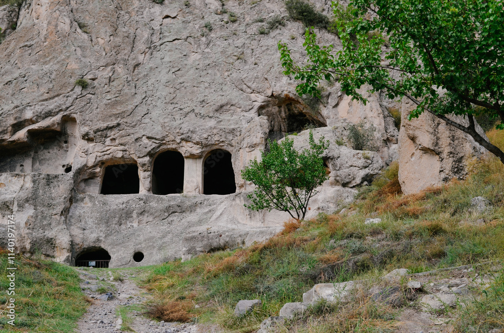 View of Vardzia caves. Vardzia is a cave monastery site in southern Georgia, excavated from the slopes of the Erusheti Mountain on the left bank of the Kura River. Travel for tourists View of Vardzia caves. Vardzia is a cave monastery site in southern Georgia, excavated from the slopes of the Erusheti Mountain on the left bank of the Kura River. Travel for tourists