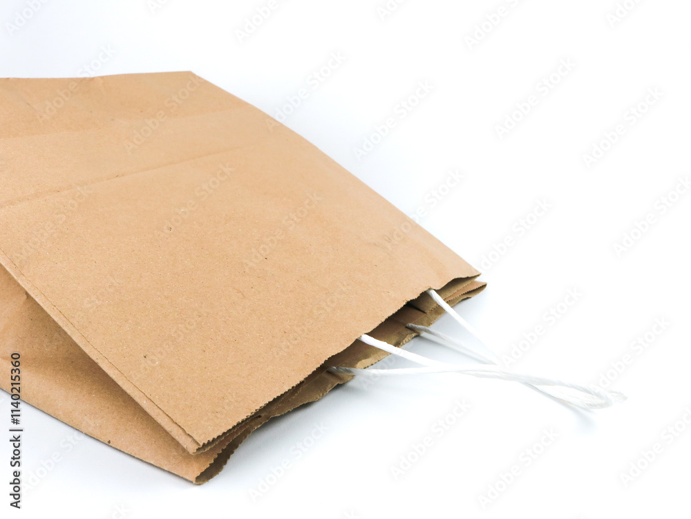 Brown empty paper bag for stuffs container in white isolated background Brown empty paper bag for stuffs container in white isolated background
