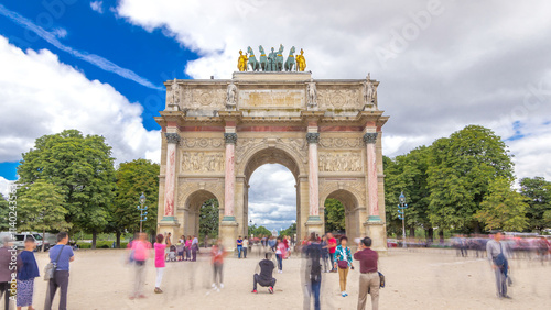 Triumphal Arch timelapse hyperlapse at Tuileries gardens in Paris, France. photo