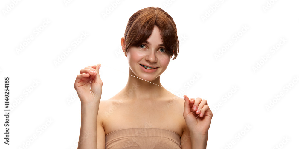 Young beautiful woman holding dental floss and smiling confidently, promoting oral hygiene and self-care against white studio background. Natural beauty, skin care, cosmetics and cosmetology concept Young beautiful woman holding dental floss and smiling confidently, promoting oral hygiene and self-care against white studio background. Natural beauty, skin care, cosmetics and cosmetology concept
