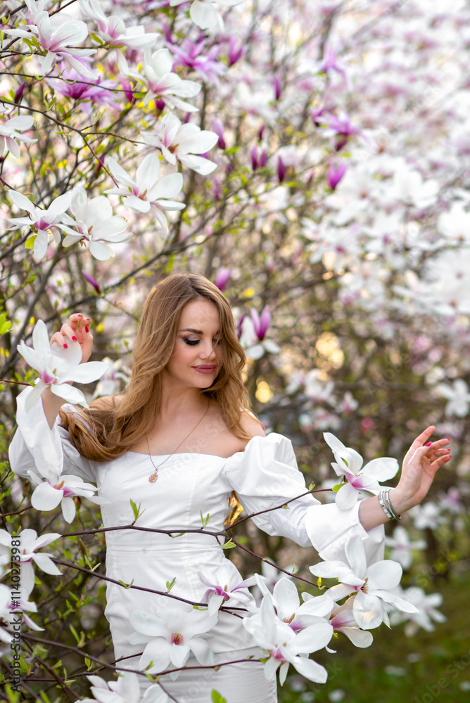 Magnolia. Magnolia Tree Garden. Young beautiful girl in magnolia tree flowers. Magnolia. Magnolia Tree Garden. Young beautiful girl in magnolia tree flowers.