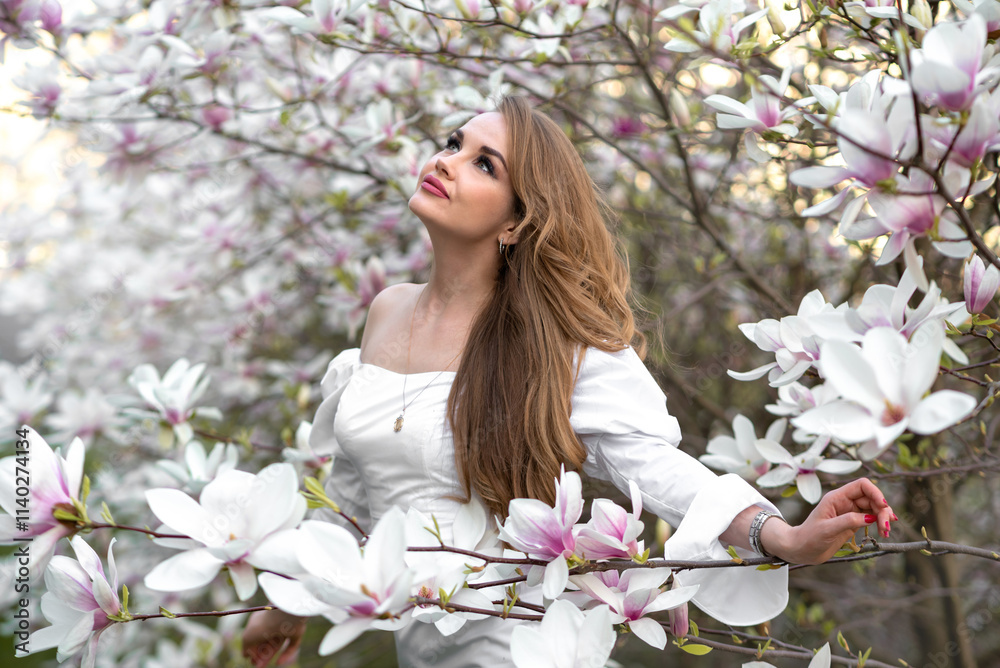 Magnolia. Magnolia Tree Garden. Young beautiful girl in magnolia tree flowers. Magnolia. Magnolia Tree Garden. Young beautiful girl in magnolia tree flowers.