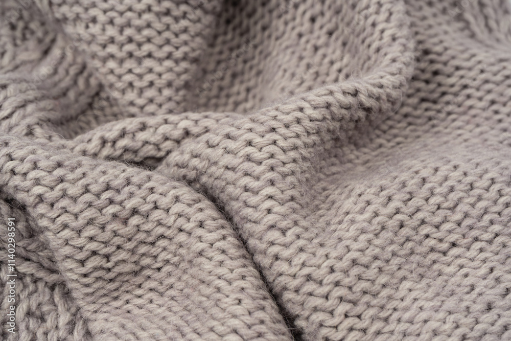 Grey wool sweater texture as a background. Grey wool sweater texture as a background.