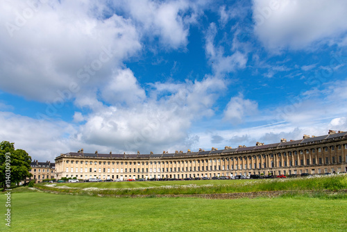 Lawn with wildflowers in front of The Royal Crescent  terraced houses Bath, Somerset, UK by architect John Wood, the Younger and built between 1767 and 1774 in Georgian architecture photo