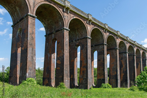 The Ouse Valley Viaduct (or Balcombe Viaduct) near Balcome, UK, for the London-Brighton Railway Line over the River Ouse with design and structure of arched vaulting supporting brick piers