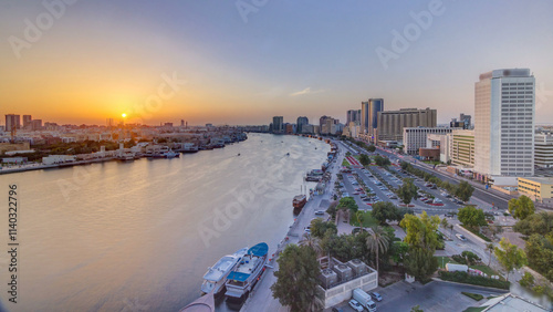 Dubai creek landscape at sunset timelapse with boats and ship near waterfront