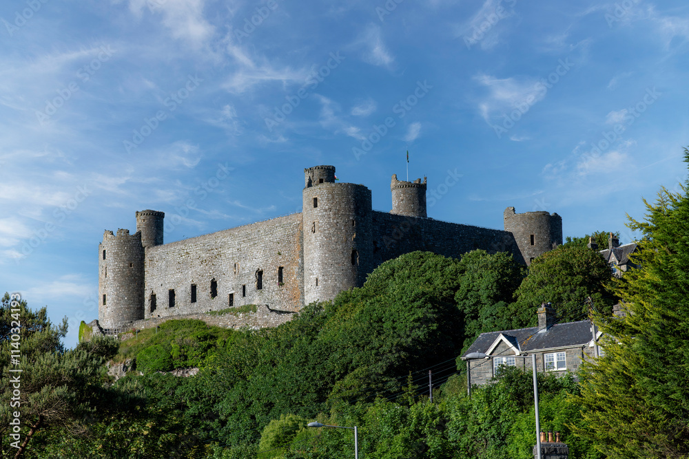 Low angle view of medieval fortification Harlech Castle in Harlech, Gwynedd, Wales, UK built on a rocky knoll by Edward I during his invasion of Wales Low angle view of medieval fortification Harlech Castle in Harlech, Gwynedd, Wales, UK built on a rocky knoll by Edward I during his invasion of Wales