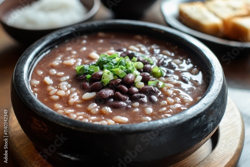 Patjuk Dongji Red bean porridge with rice cake a traditional Korean dish photo