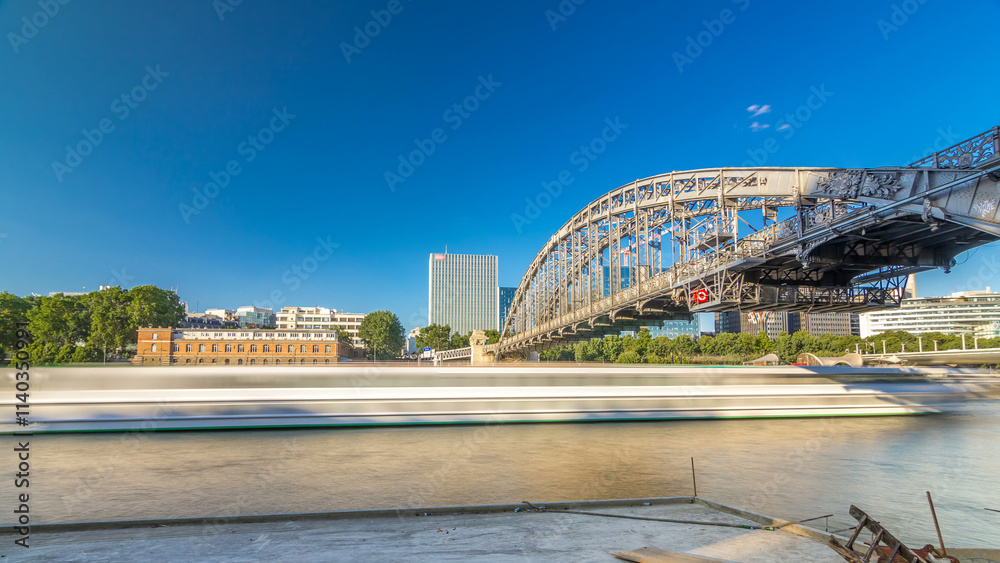 Fototapeta premium The Austerlitz viaduct in Paris timelapse hyperlapse, seen from bank of the river Seine with a metro train passing