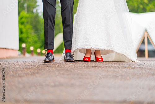 Принти на полотні Close-Up of Wedding Couple's Footwear Featuring Red Shoes and Socks on Outdoor V