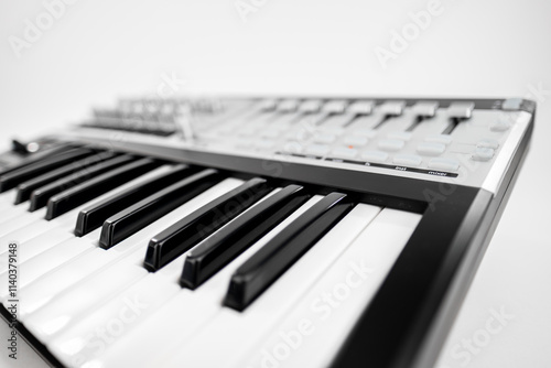 Close-Up View of a Digital Keyboard with Black and White Keys on a Clean Background