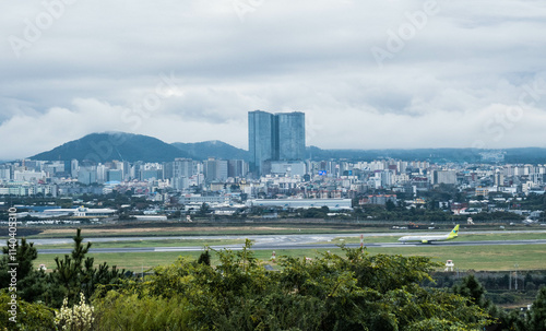 View of Jeju Dream Tower from Dodubong Peak, Jeju City, Jeju Island, South Korea photo