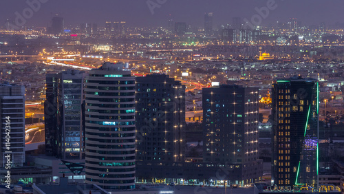 Wallpaper Mural Dubai's business bay towers at evening aerial day to night timelapse. Torontodigital.ca