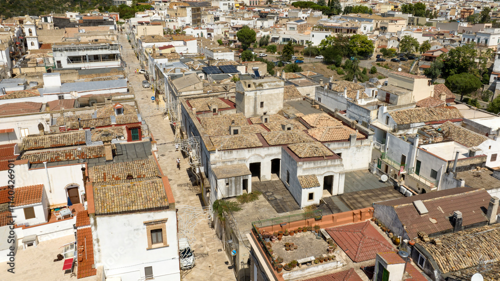Aerial view of houses, apartments and buildings located in the historic center of the town of Bernalda, in the province of Matera, Basilicata, Italy. It is a traditional Italian village. Aerial view of houses, apartments and buildings located in the historic center of the town of Bernalda, in the province of Matera, Basilicata, Italy. It is a traditional Italian village.