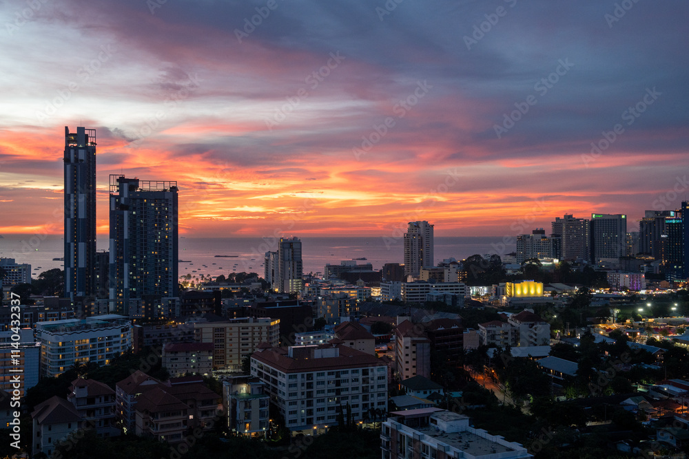Fototapeta premium Sunset view from the 22nd floor of a condominium in Pattaya town Chonburi district Thailand Asia