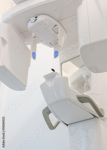 Vertical shot of a panoramic dental X-ray machine (orthopantomograph), designed for capturing comprehensive images of the teeth and jaw in dentistry photo