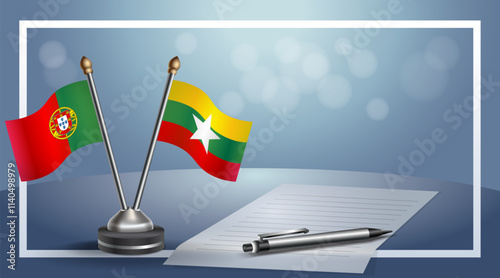 Portugal and Myanmar National flags on small table with bokeh background, cooperative relationship