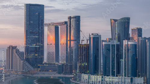 Buildings on Al Reem island in Abu Dhabi timelapse from above. photo