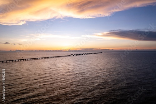 Beautiful sunset sky over the Blue Bridge on Weizhou Island in Beihai, Guangxi Province photo