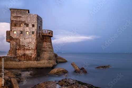 Ancient fortress by the sea at Guangdong Shanwei Honghaiwan Scenic Area during twilight hours photo