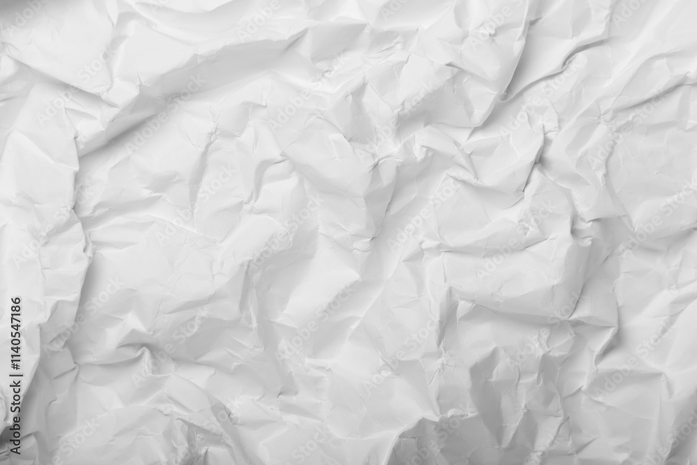 Obraz premium White crumpled paper creating an abstract texture background