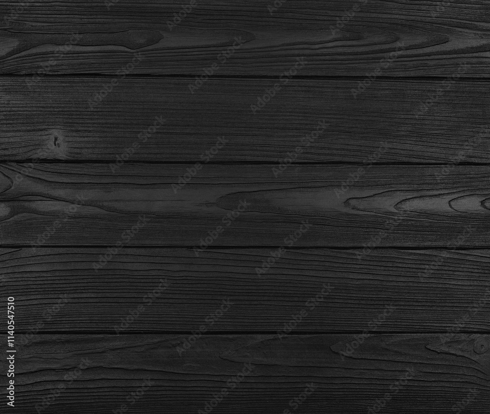 Dark wooden planks showing wood grain creating dramatic background Dark wooden planks showing wood grain creating dramatic background
