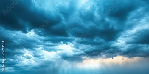 Dramatic storm clouds looming over a serene landscape, showcasing shades of blue and hints of warm sunlight.