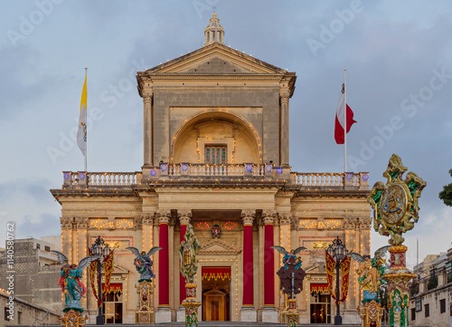 Wallpaper Mural St.Joseph Church in Kalkara, Malta, beautifully decorated with lights and festive ornaments during San Guzepp celebration, against twilight sky Torontodigital.ca