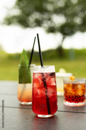 Refreshing summer beverages on outdoor table photo