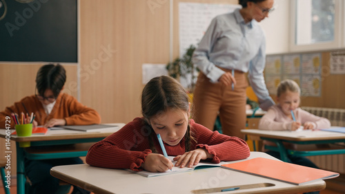 Bild auf Leinwand School class lesson children studying learning in classroom woman teacher female