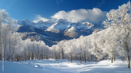 Snow covered path leads to majestic mountain range surrounded by trees at dawn