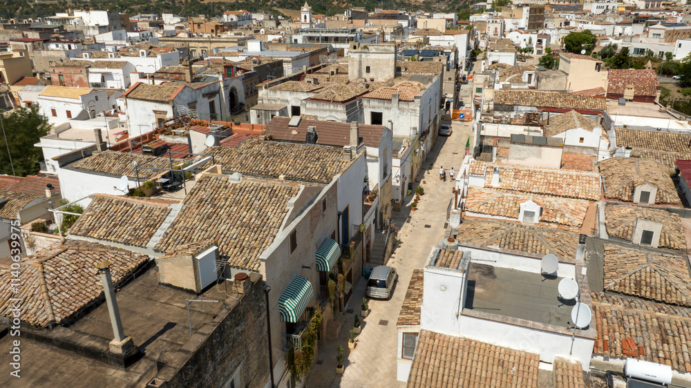 Fototapeta premium Aerial view of an alley in the historic center of the town of Bernalda, in the province of Matera, Basilicata, Italy. It is a traditional Italian village.