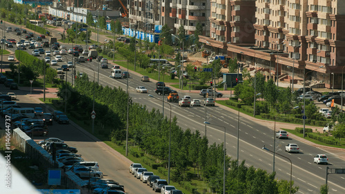 Car drives on street Traffic over the wide boulevards of Astana in Kazakhstan photo