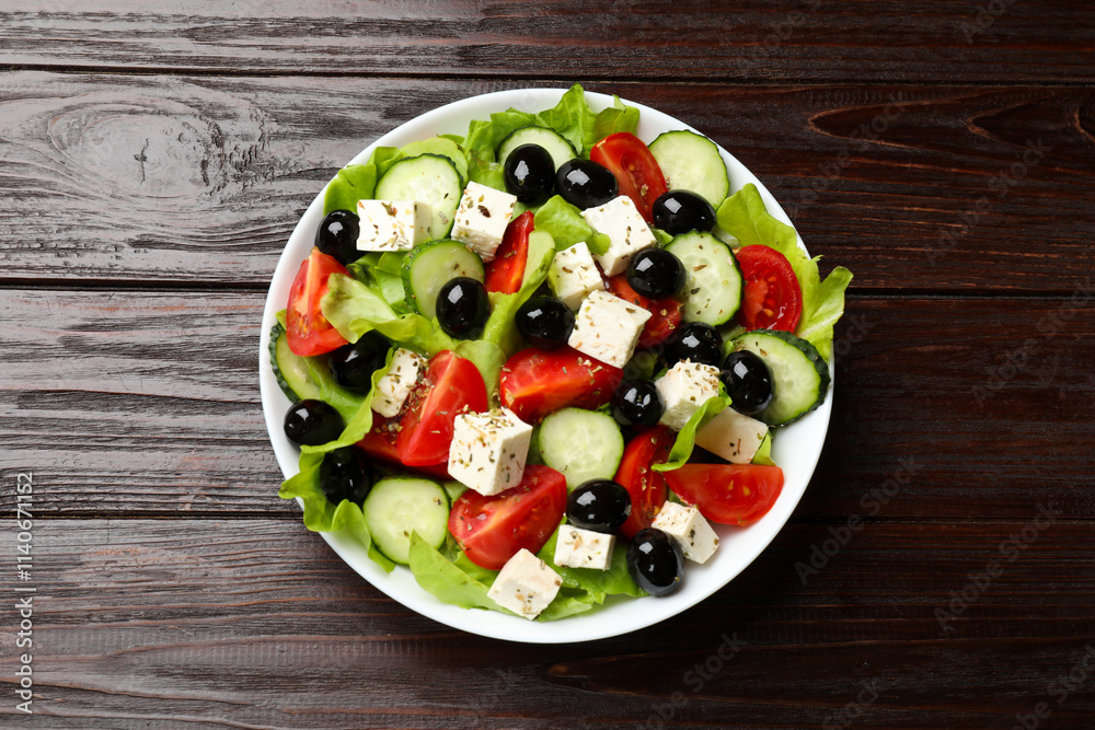 Delicious salad with feta cheese on wooden table, top view Delicious salad with feta cheese on wooden table, top view