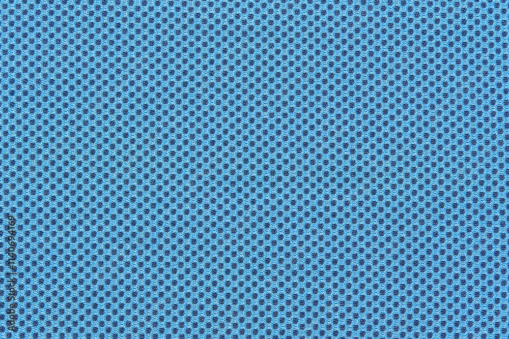 Blue textured fabric with small black dots pattern for fashion and interior design. Blue textured fabric with small black dots pattern for fashion and interior design.