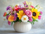 a bright bouquet of colorful flowers in a white vase