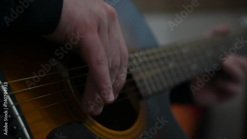 The Boy and the Acoustic Guitar
An acoustic guitar is a guitar in which the sound is produced by the vibration of the strings and propagates at audible intensities through the resonance of the soundbo